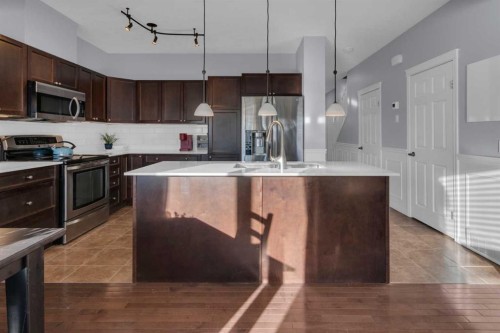 605-620 Luxstone Landing Sw, Airdrie, AB - Indoor Photo Showing Kitchen With Double Sink