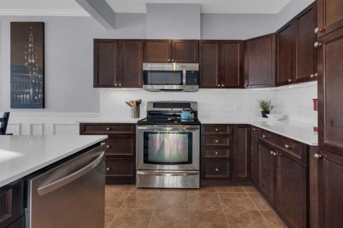 605-620 Luxstone Landing Sw, Airdrie, AB - Indoor Photo Showing Kitchen With Double Sink