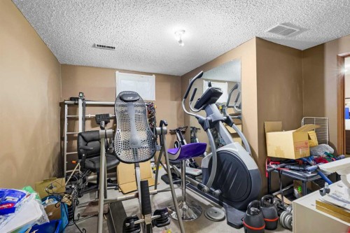 1016 Hunterdale Place Nw, Calgary, AB - Indoor Photo Showing Gym Room