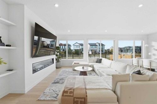 65 Rowmont Link Nw, Calgary, AB - Indoor Photo Showing Living Room With Fireplace