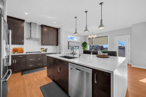 660 Reynolds Crescent Sw, Airdrie, AB - Indoor Photo Showing Kitchen With Upgraded Kitchen