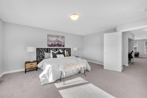 660 Reynolds Crescent Sw, Airdrie, AB - Indoor Photo Showing Bedroom