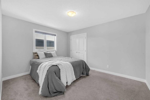 660 Reynolds Crescent Sw, Airdrie, AB - Indoor Photo Showing Bedroom