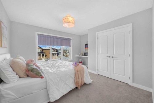 660 Reynolds Crescent Sw, Airdrie, AB - Indoor Photo Showing Bedroom
