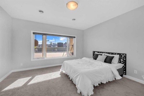 660 Reynolds Crescent Sw, Airdrie, AB - Indoor Photo Showing Bedroom