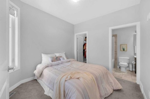 660 Reynolds Crescent Sw, Airdrie, AB - Indoor Photo Showing Bedroom