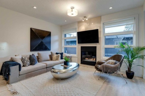 933 32 Street Nw, Calgary, AB - Indoor Photo Showing Living Room With Fireplace