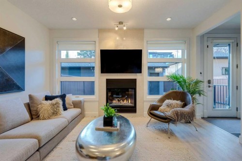 933 32 Street Nw, Calgary, AB - Indoor Photo Showing Living Room With Fireplace