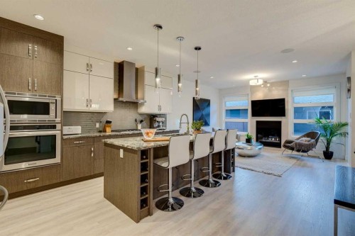 933 32 Street Nw, Calgary, AB - Indoor Photo Showing Kitchen With Fireplace With Upgraded Kitchen