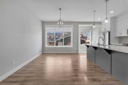 41 Sunrise Heights, Cochrane, AB - Indoor Photo Showing Kitchen With Upgraded Kitchen