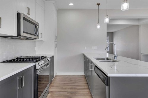 41 Sunrise Heights, Cochrane, AB - Indoor Photo Showing Kitchen With Double Sink With Upgraded Kitchen