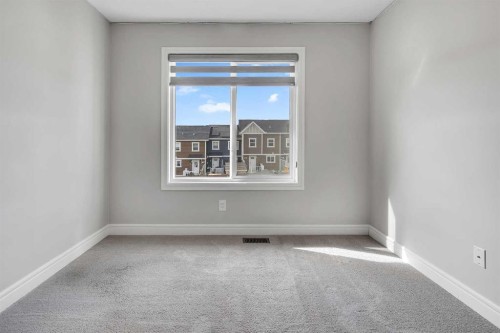 41 Sunrise Heights, Cochrane, AB - Indoor Photo Showing Other Room