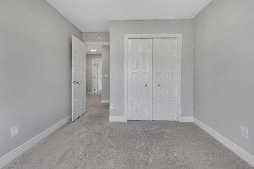 41 Sunrise Heights, Cochrane, AB - Indoor Photo Showing Other Room