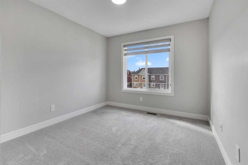 41 Sunrise Heights, Cochrane, AB - Indoor Photo Showing Other Room