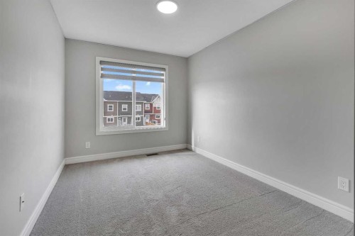 41 Sunrise Heights, Cochrane, AB - Indoor Photo Showing Other Room