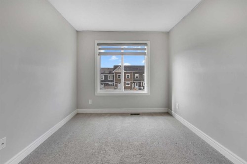 41 Sunrise Heights, Cochrane, AB - Indoor Photo Showing Other Room