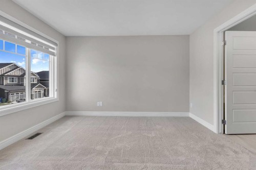 41 Sunrise Heights, Cochrane, AB - Indoor Photo Showing Other Room