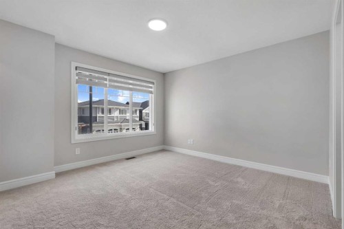 41 Sunrise Heights, Cochrane, AB - Indoor Photo Showing Other Room