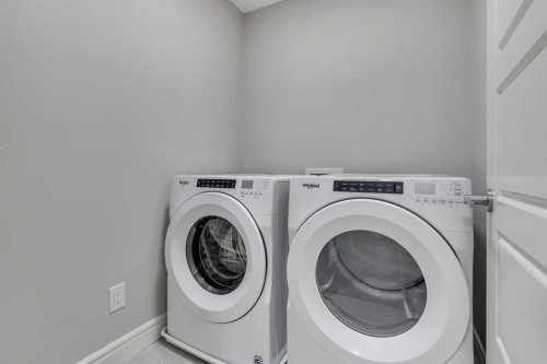 41 Sunrise Heights, Cochrane, AB - Indoor Photo Showing Laundry Room