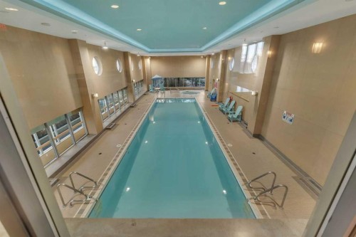 1205-55 Spruce Place Sw, Calgary, AB - Indoor Photo Showing Other Room With In Ground Pool