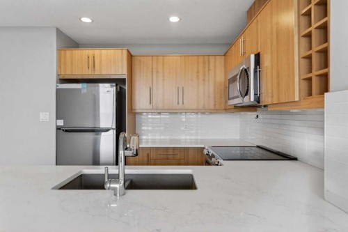 1205-55 Spruce Place Sw, Calgary, AB - Indoor Photo Showing Kitchen With Double Sink