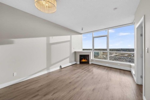 1205-55 Spruce Place Sw, Calgary, AB - Indoor With Fireplace