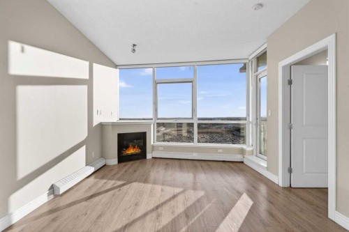 1205-55 Spruce Place Sw, Calgary, AB - Indoor With Fireplace