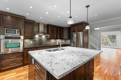 810-3130 66 Avenue Sw, Calgary, AB - Indoor Photo Showing Kitchen With Stainless Steel Kitchen With Double Sink With Upgraded Kitchen