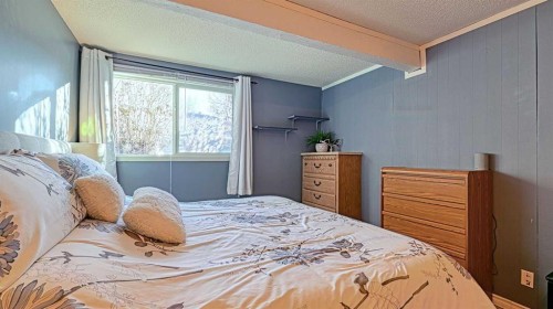 152 Oaktree Lane Sw, Calgary, AB - Indoor Photo Showing Bedroom