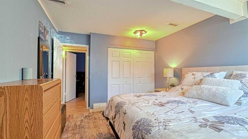 152 Oaktree Lane Sw, Calgary, AB - Indoor Photo Showing Bedroom