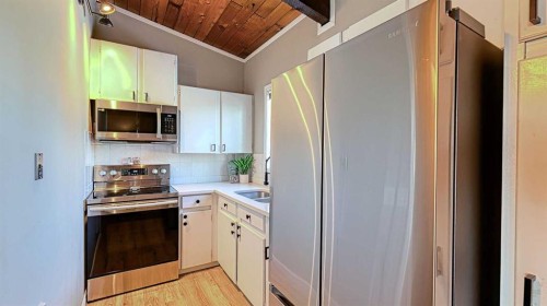 152 Oaktree Lane Sw, Calgary, AB - Indoor Photo Showing Kitchen With Double Sink