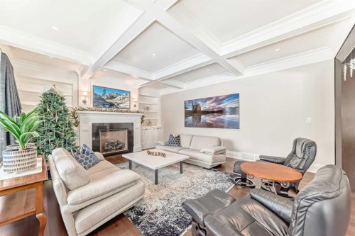 67 Rosery Drive Nw, Calgary, AB - Indoor Photo Showing Living Room With Fireplace