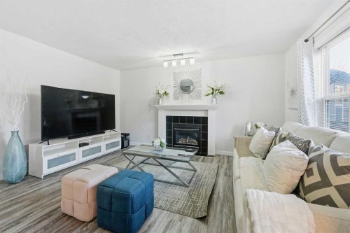 58 Bridlecrest Road Sw, Calgary, AB - Indoor Photo Showing Living Room With Fireplace