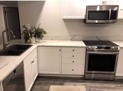 9927 Scurfield Drive Nw, Calgary, AB - Indoor Photo Showing Kitchen With Double Sink