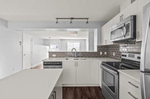 4 Evanscrest Gardens Nw, Calgary, AB - Indoor Photo Showing Kitchen With Stainless Steel Kitchen With Upgraded Kitchen