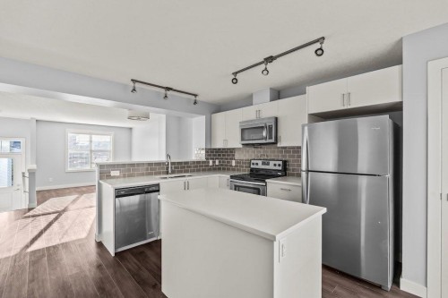 4 Evanscrest Gardens Nw, Calgary, AB - Indoor Photo Showing Kitchen With Stainless Steel Kitchen With Upgraded Kitchen