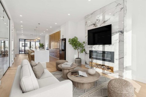 159 Lake Sylvan Close Se, Calgary, AB - Indoor Photo Showing Living Room With Fireplace