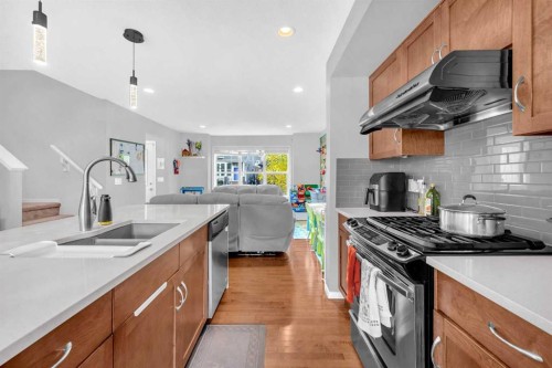 45 Nolanfield Lane Nw, Calgary, AB - Indoor Photo Showing Kitchen With Stainless Steel Kitchen With Double Sink With Upgraded Kitchen