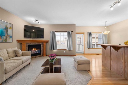 123-100 Coopers Common Sw, Airdrie, AB - Indoor Photo Showing Living Room With Fireplace