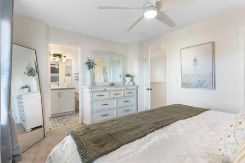 340 Kingsmere Way Se, Airdrie, AB - Indoor Photo Showing Bedroom