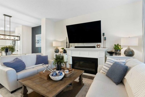 340 Kingsmere Way Se, Airdrie, AB - Indoor Photo Showing Living Room With Fireplace