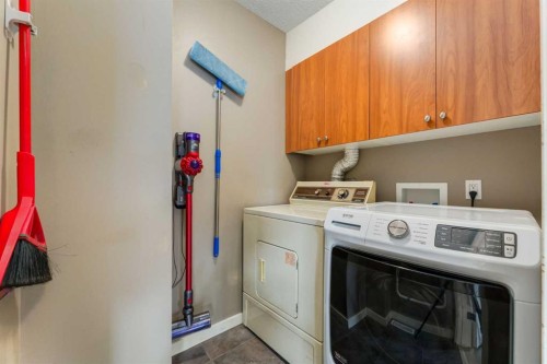 D-4528 73 Street Nw, Calgary, AB - Indoor Photo Showing Laundry Room