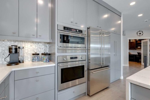 8 Cameron Close, Okotoks, AB - Indoor Photo Showing Kitchen With Stainless Steel Kitchen With Upgraded Kitchen