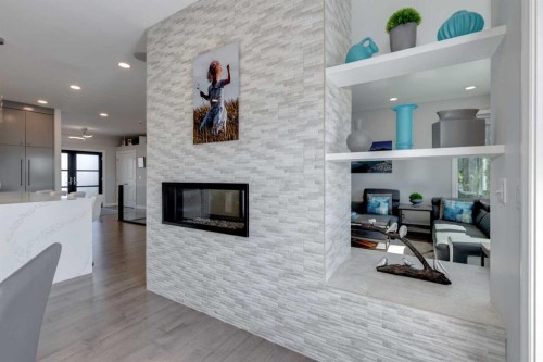 8 Cameron Close, Okotoks, AB - Indoor Photo Showing Living Room With Fireplace