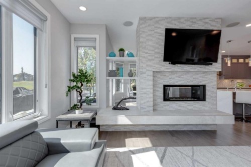 8 Cameron Close, Okotoks, AB - Indoor Photo Showing Living Room With Fireplace