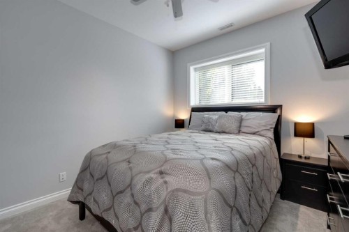 8 Cameron Close, Okotoks, AB - Indoor Photo Showing Bedroom