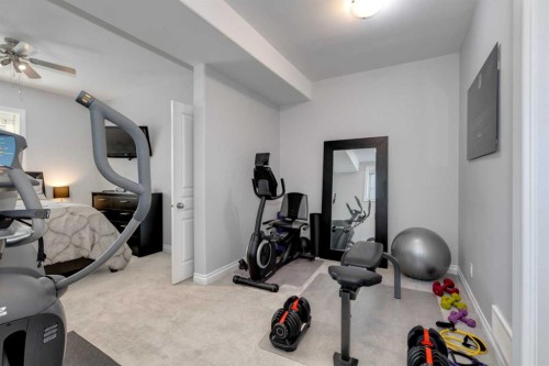 8 Cameron Close, Okotoks, AB - Indoor Photo Showing Gym Room