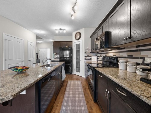 73 Cranberry Avenue Se, Calgary, AB - Indoor Photo Showing Kitchen With Double Sink With Upgraded Kitchen