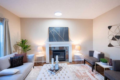 306 Rockyspring Circle Nw, Calgary, AB - Indoor Photo Showing Living Room With Fireplace