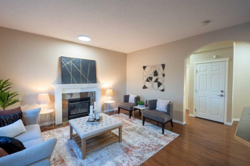 306 Rockyspring Circle Nw, Calgary, AB - Indoor Photo Showing Living Room With Fireplace